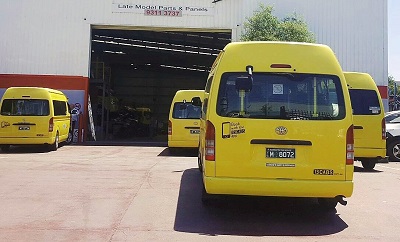 taxi hiace commuter bus waiting to be serviced